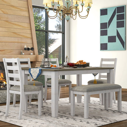 Brown and whitewash dining table with upholstered ladder-back chairs and bench beside a fireplace