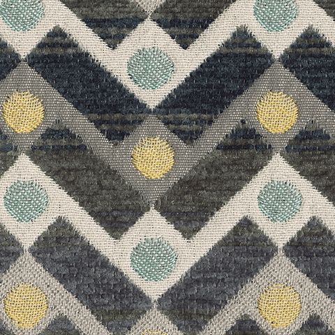 Close-up of Ambee accent pillow fabric with gray chevrons and teal and yellow dots