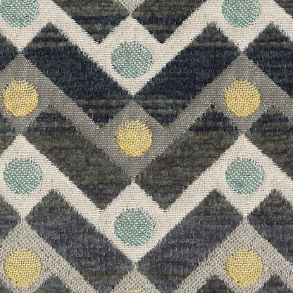 Close-up of Ambee accent pillow fabric with gray chevrons and teal and yellow dots