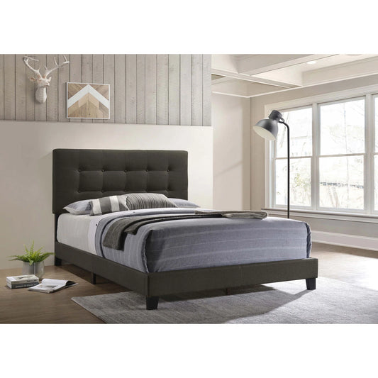 Dordrecht charcoal upholstered bed with a button-tufted headboard in a bedroom