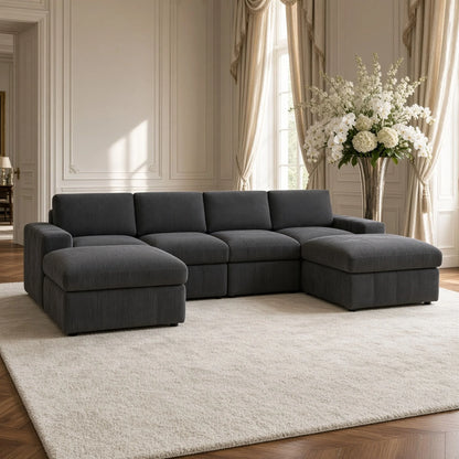 Dark gray modular sofa with two ottomans arranged as chaises in a living room