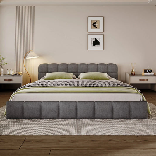 Front view of a dark gray upholstered bed with checkerboard padded headboard and footboard in a bedroom