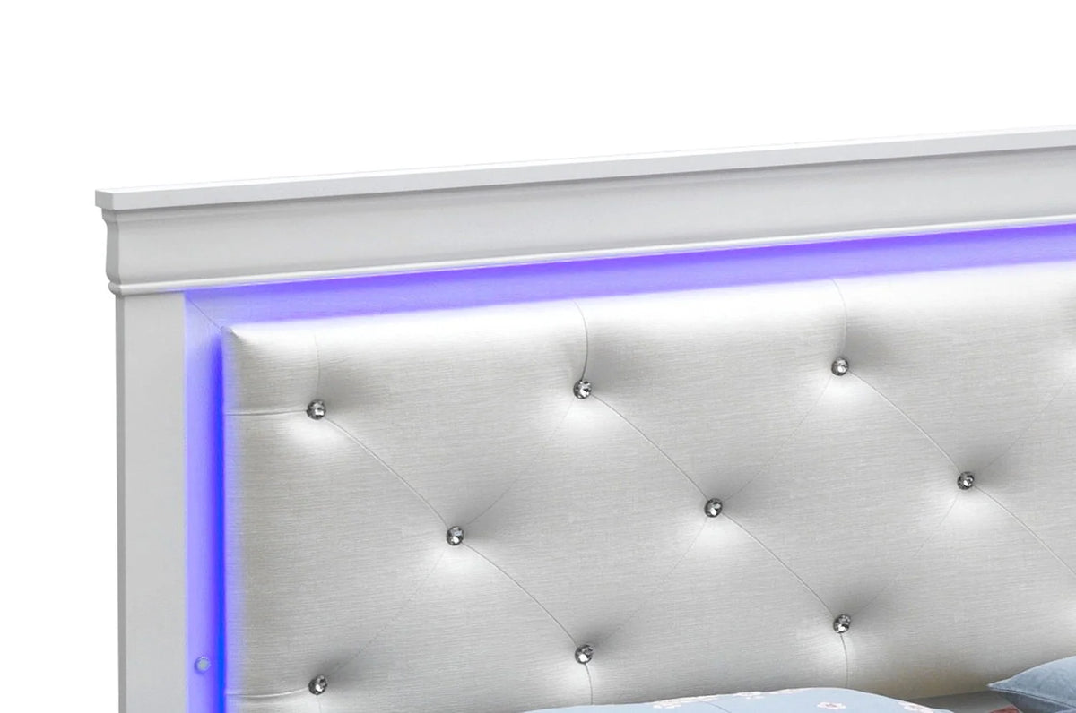 Close-up of the champagne bed headboard with diamond tufting and blue-purple LED border lighting