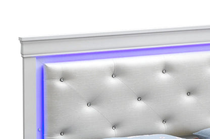 Close-up of the champagne bed headboard with diamond tufting and blue-purple LED border lighting