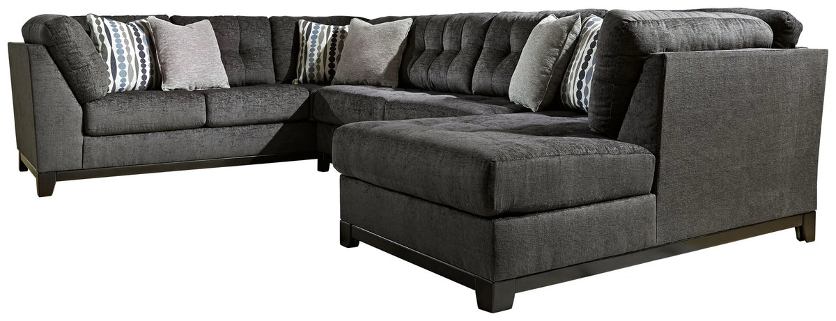 Reidshire steel gray sectional with a chaise on the right and accent pillows on a white background